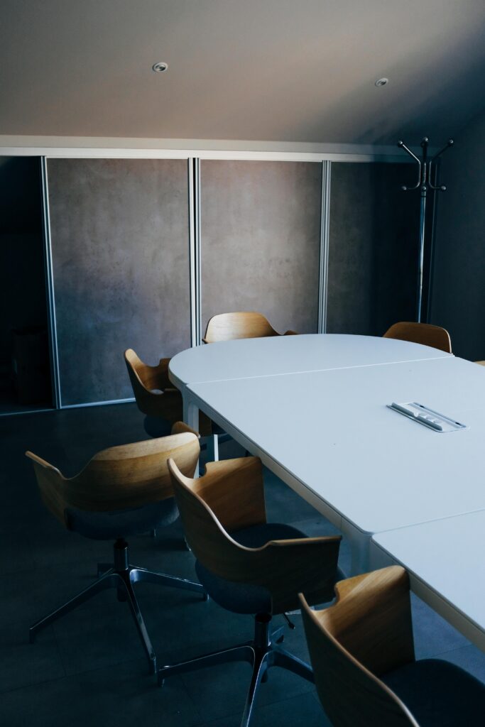 pexels-photo-3767172-3767172 From above of stylish interior of modern conference hall with comfortable chairs and oval table